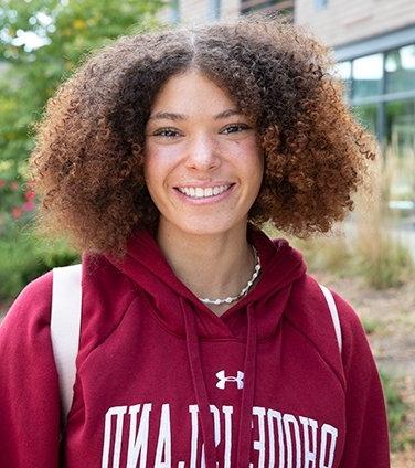 Smiling female student in RIC sweatshirt